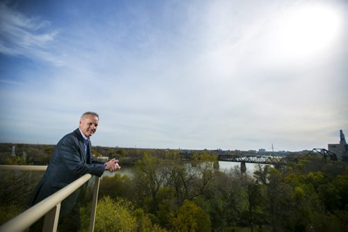 Developer Fausto Pereira poses for portraits on his balcony at The Excelsior, which he developed and now lives in, for The Rivers project  in Winnipeg on Friday, Oct. 9, 2015.  (Mikaela MacKenzie/Winnipeg Free Press)