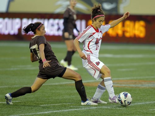 Universtity womens soccer at IGF. University of Manitoba #17 Chelsea Dubiel battles with University of Winnipeg #18 Rachel Dunsmore. BORIS MINKEVICH / WINNIPEG FREE PRESS  OCT 9, 2015