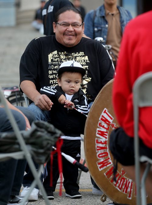 Lorne Redsky from Shoal Lake 40 and his son, Tanner, gathered at the Legislative Building for the Goodbye Harper Happy Dance, Saturday, October 10, 2015. (TREVOR HAGAN/WINNIPEG FREE PRESS)