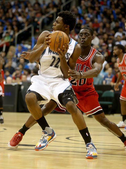Minnesota Timberwolves' Andrew Wiggins dribbles the ball in front of Chicago Bulls' Tony Snell during an exhibition game at MTS Centre, Saturday, October 10, 2015. (TREVOR HAGAN/WINNIPEG FREE PRESS)