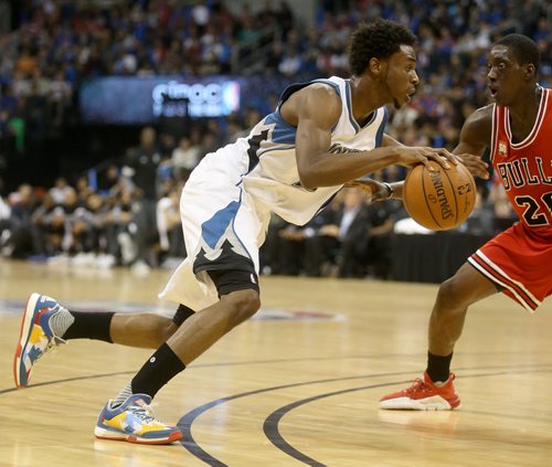 Minnesota Timberwolves' Andrew Wiggins dribbles the ball in front of Chicago Bulls' Tony Snell during an exhibition game at MTS Centre, Saturday, October 10, 2015. (TREVOR HAGAN/WINNIPEG FREE PRESS)