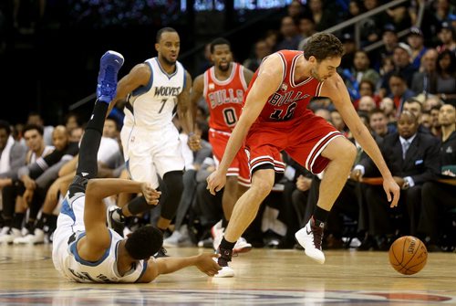 Minnesota Timberwolves' Karl-Anthony Towns tries to grab the loose ball away from Chicago Bulls' Pau Gasol during an exhibition game at MTS Centre, Saturday, October 10, 2015. (TREVOR HAGAN/WINNIPEG FREE PRESS)