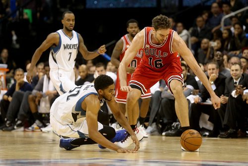 Minnesota Timberwolves' Karl-Anthony Towns tries to grab the loose ball away from Chicago Bulls' Pau Gasol during an exhibition game at MTS Centre, Saturday, October 10, 2015. (TREVOR HAGAN/WINNIPEG FREE PRESS)