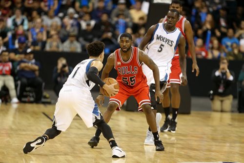 Minnesota Timberwolves' Tyrus Jones tries to get past Chicago Bulls' E'twaun Moore during an exhibition game at MTS Centre, Saturday, October 10, 2015. (TREVOR HAGAN/WINNIPEG FREE PRESS)