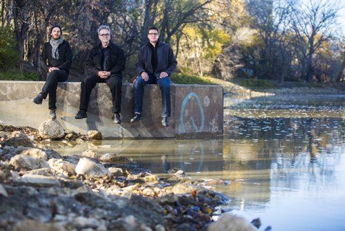 Architects Stephen Faust (left), David Penner, and Chris Wiebe, at a river access point in Winnipeg on Tuesday, Oct. 13, 2015.  Their proposal centres around a cycling "freeway" along the river.  (Mikaela MacKenzie/Winnipeg Free Press) --for The Rivers project