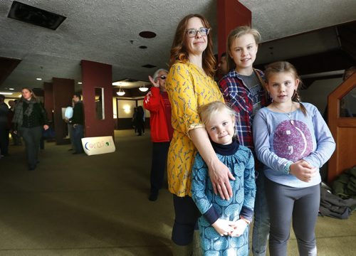Jennifer McRae-King with her children from left, Poet,6, Meguire,13, and Piper-Prairie, 9, attended the rally at the Winnipeg Central Mosque on Ellice Ave. Tuesday in support of Muslim women who wear the veil that covers their hair and face except for their eyes.This is their first time in a Mosque.  Carol Sanders story Wayne Glowacki / Winnipeg Free Press October 13 2015