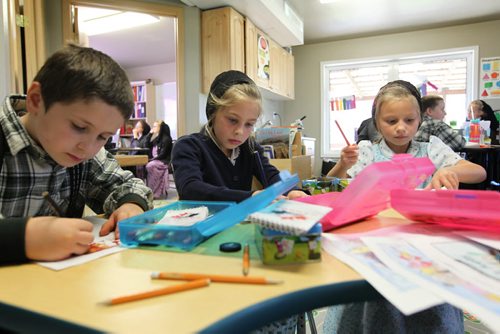 Students of all ages do their separate work in a  k - 8 class at Emerald Hutterite Colony.  Feature story on Pine Creek School Division's TMO teaching program (audio program) for distance learning.  See Nick Martin's story.  Oct 13, 2015 Ruth Bonneville / Winnipeg Free Press play