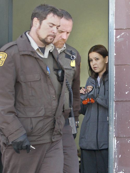 Easterville, Manitoba- Shelly Lynne Chartier  is removed from court in handcuffs by Sheriffs officers in Easterville, Manitoba Wednesday  after being sentenced to 18 months jail for Impersonation and Fraud charges related to a elaborate online scam which targeted several high profile victims including NBA star. See Mike McIntyre story - Oct 14, 2015   (JOE BRYKSA / WINNIPEG FREE PRESS)
