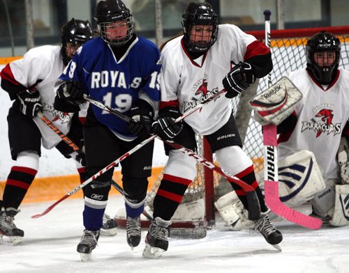 Selkirk vs Belliveau high school hockey. Selkirk #19 Taylor Fontain  battles with Belliveau Brianna Vince. BORIS MINKEVICH / WINNIPEG FREE PRESS  OCT 14, 2015
