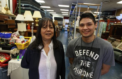 SUNSHINE FUND - Millie Anderson, executive director of Oyate Tipi Cumini Yape poses for a photo with Warehouse/Driver assistant Cole Scott. 606 Selkirk Ave. BORIS MINKEVICH / WINNIPEG FREE PRESS  OCT 14, 2015