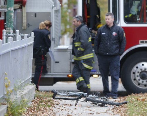 Winnipeg Police and Fire Fighters at the intersection of Manitoba Ave. and McNichol St. after a Thursday morning collision incident. Wayne Glowacki / Winnipeg Free Press October 15 2015