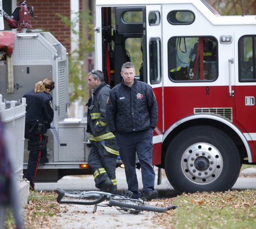 Winnipeg Police and Fire Fighters at the intersection of Manitoba Ave. and McNichol St. Thursday morning after collision incident. Wayne Glowacki / Winnipeg Free Press October 15 2015