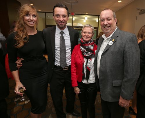 (L-R) Brenda Magalas, Curtis Newton (auctioneer), Shelley McIntosh and husband Larry McIntosh of Peak of the Market. Photo by Jason Halstead/Winnipeg Free Press RE: Social page