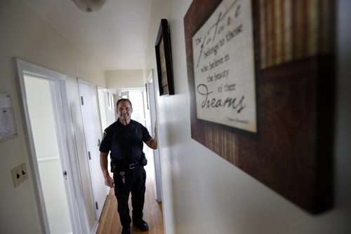 49.8  Winnipeg Police Const. Gerry Bernas works on crime prevention through social development. He is at a group home dropping off information for two youth residents.   This is part of the Winnipeg Police Service East District Station Community Support Unit.  Kevin Rollason story on the SMART Policing Initiative (SPI).   Wayne Glowacki / Winnipeg Free Press October 9 2015