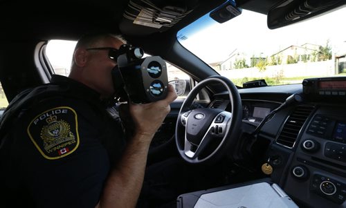 49.8  Winnipeg Police Const. Sal Signorino monitors the speed drivers on Concordia Ave. He was there after resident's complaints of speeders. This is part of the Winnipeg Police Service East District Station Community Support Unit.  Kevin Rollason story on the SMART Policing Initiative (SPI).   Wayne Glowacki / Winnipeg Free Press October 9 2015