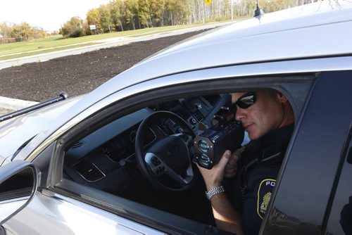 49.8  Winnipeg Police Const. Sal Signorino monitors speed of drivers on Concordia Ave. He was there after resident's complaints of speeders. This is part of the Winnipeg Police Service East District Station Community Support Unit.  Kevin Rollason story on the SMART Policing Initiative (SPI).   Wayne Glowacki / Winnipeg Free Press October 9 2015