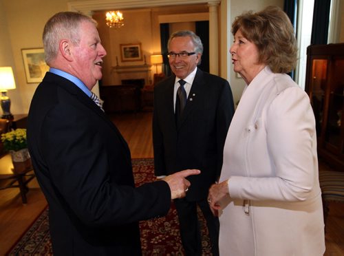 General (Ret'd) Rick Hillier gets warm greetings from Honourable Janice Filmon(right) , Lieutenant Governor of Manitoba, and Gary Filmon (centre) at Government House. They were at a reception and announcement from TPL (True Patriot Love, a foundation that raises money to help military people.  BORIS MINKEVICH / WINNIPEG FREE PRESS  OCT 15, 2015