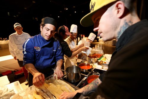 Chef Fabrizio Rossi, left, from Nicolinos, preparing polenta, during the Gold Medal Plates competition at the Convention Centre, Friday, October 16, 2015. (TREVOR HAGAN/WINNIPEG FREE PRESS)