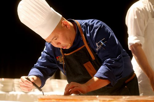 Chef Edward Lam, from Yujiro, plating his dish, foie gras lobster terrine, Gold Medal Plates competition at the Convention Centre, Friday, October 16, 2015. (TREVOR HAGAN/WINNIPEG FREE PRESS)