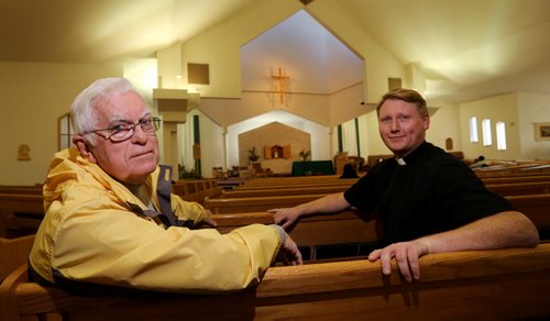 Greg Barrett and Rev. Kevin Bettens of Mary, Mother of the Church, Saturday, October 17, 2015. (TREVOR HAGAN/WINNIPEG FREE PRESS)