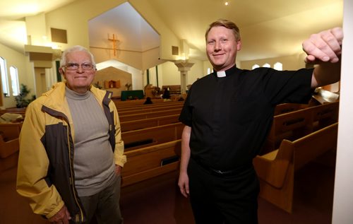 Greg Barrett and Rev. Kevin Bettens of Mary, Mother of the Church, Saturday, October 17, 2015. (TREVOR HAGAN/WINNIPEG FREE PRESS)