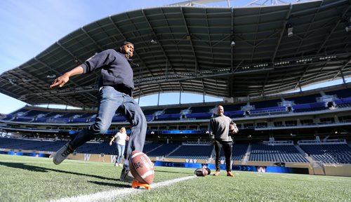 NBA Champion John Salley kicking a field goal at Investors Group Field, as Troy Westwood looks on, during The Celebrity Human Race, an HSC Foundation fundraiser, Saturday, October 17, 2015. (TREVOR HAGAN/WINNIPEG FREE PRESS)