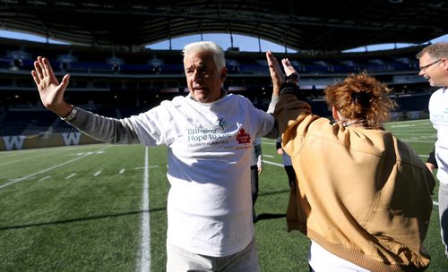 Actor John O'Hurley celebrating with his team at Investors Group Field, during The Celebrity Human Race, an HSC Foundation fundraiser, Saturday, October 17, 2015. (TREVOR HAGAN/WINNIPEG FREE PRESS)