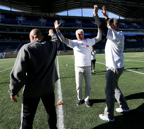 Actor John O'Hurley celebrating with his team at Investors Group Field, during The Celebrity Human Race, an HSC Foundation fundraiser, Saturday, October 17, 2015. (TREVOR HAGAN/WINNIPEG FREE PRESS)