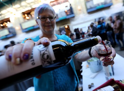 Marjorie Fortier, from Renaissance Wines pours a sample of wine during the International Wine Festival at The Forks, Saturday, October 17, 2015. (TREVOR HAGAN/WINNIPEG FREE PRESS)