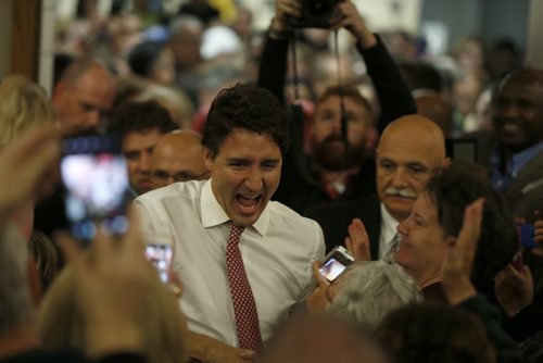 Liberal leader Justin Trudeau is greeted with a roaring, full-house crowd as he walks into the hall area  at St. James Civic Centre Saturday night.   Oct 17, 2015 Ruth Bonneville / Winnipeg Free Press play