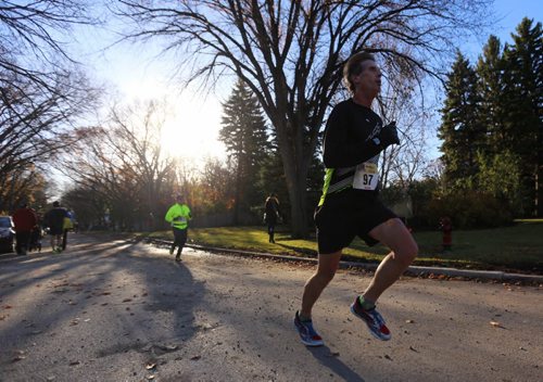 Participants in the WFPS Half Marathon run along Mountbatten Avenue, Sunday, October 18, 2015. (TREVOR HAGAN / WINNIPEG FREE PRESS)