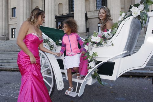 October 18, 2015 - 151018  -  Princess Gillian Bridges assists Princess Kyanna Speiss, (5) off a horse drawn carriage as Princess Tiffany Tran  looks on at the Princess For A Day fundraising event  for the Children's Wish Foundation at the Manitoba Legislature Sunday, October 18, 2015. Princess for a Day Provides Fun, Fantasy for Little Girls with Life-Threatening Diseases. Approximately 100 little girls, including 40 battling life-threatening or chronic illnesses, will each soon be crowned Princess for a Day as part of a unique fundraising event for the Childrens Wish Foundation  Manitoba and Nunavut.   John Woods / Winnipeg Free Press