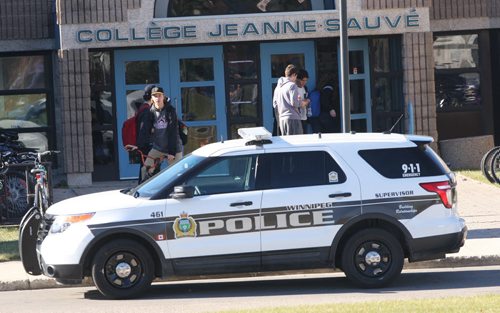 Winnipeg Police on scene at Collège Jeanne-Sauvé 1128 Dakota St doing a medical emergency investigation- Voting at location is still on- a new door has been opened as investigation continues    -See story -Oct 19, 2015   (JOE BRYKSA / WINNIPEG FREE PRESS)