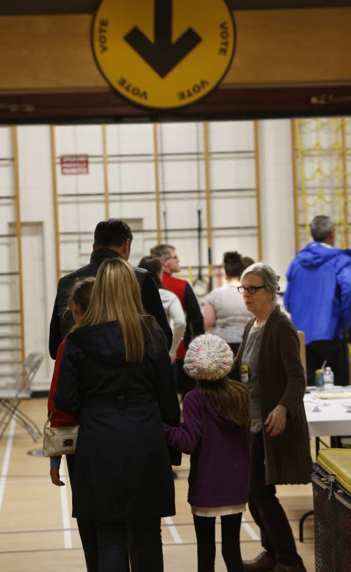 A steady flow of voters in the federal election at the polling station in Oakenwald School at 6:30pm Monday. The wait time was about 5minutes.  Wayne Glowacki / Winnipeg Free Press October 19 2015