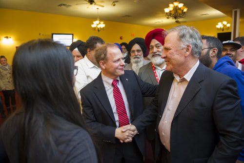 DAVID LIPNOWSKI / WINNIPEG FREE PRESS 151019  Incumbent Liberal Kevin Lamoureaux (red tie) joins supporters at the Punjab Banquet Hall in his Winnipeg North riding Monday October 19, 2015.