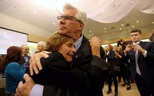 Jim Carr embraces his aunt, Frances Miles at his election victory party at the Caboto Centre, Monday, October 19, 2015. (TREVOR HAGAN/WINNIPEG FREE PRESS)