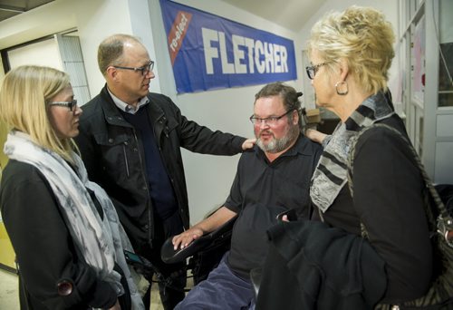 DAVID LIPNOWSKI / WINNIPEG FREE PRESS 151019  Incumbent Conservative Steven Fletcher is embraced by supporters at his Headquarter in the Charleswood-StJames-Assiniboia-Headingley riding Monday October 19, 2015 after being defeated in the federal election.