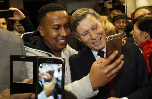 At right,  Liberal candidate Terry Duguid poses for a picture with supporters at his Winnipeg South HQ after he was elected Monday night.  Larry Kusch story  Wayne Glowacki / Winnipeg Free Press October 19 2015