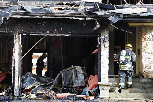 Fire fighters on scene at 55 Apex St. in Charleswood after a fire started in the home around noon Tuesday.   Standup photo  Oct 20, 2015 Ruth Bonneville / Winnipeg Free Press pla