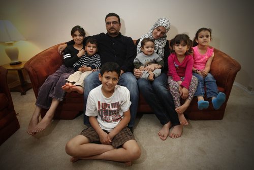 October 20, 2015 - 151020  -  Shhade and Houriay Mansour, who are recent refugees from Syria, are photographed with their six children (L to R) Asmaa, Omar, Khaled, Ahmad, Maria and Jomana in their home Tuesday, October 20, 2015. The Mansours just learned their relatives are missing and their home in a suburb of Homs was destroyed by a Russian airstrike. John Woods / Winnipeg Free Press