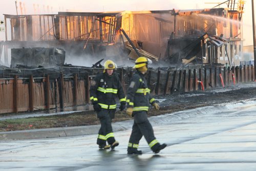 First light shows the size and destruction of the huge fire at Waverley St and Sandusky Dr that started early this morning in Winnipeg- Breaking News -Oct 22, 2015   (JOE BRYKSA / WINNIPEG FREE PRESS)