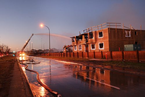 First light shows the size and destruction of the huge fire at Waverley St and Sandusky Dr that started early this morning in Winnipeg- Breaking News -Oct 22, 2015   (JOE BRYKSA / WINNIPEG FREE PRESS)