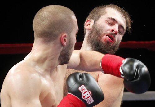 HIGH STAKES HAVOC 2 - Presented by King John Boxing @ Club Regent Casino Event Centre. Under card boxers Kane Heron from Toronto beats up Lee Spurgeon, right, from Kentucky.). Heron won in three rounds.  BORIS MINKEVICH / WINNIPEG FREE PRESS  OCT 22, 2015