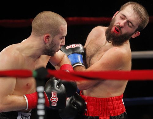 HIGH STAKES HAVOC 2 - Presented by King John Boxing @ Club Regent Casino Event Centre. Under card boxers Kane Heron from Toronto beats up Lee Spurgeon from Kentucky.(in red on right). Heron won in three rounds.  BORIS MINKEVICH / WINNIPEG FREE PRESS  OCT 22, 2015