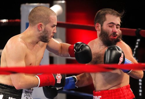 HIGH STAKES HAVOC 2 - Presented by King John Boxing @ Club Regent Casino Event Centre. Under card boxers Kane Heron from Toronto beats up Lee Spurgeon from Kentucky.(in red on right). Heron won in three rounds.  BORIS MINKEVICH / WINNIPEG FREE PRESS  OCT 22, 2015