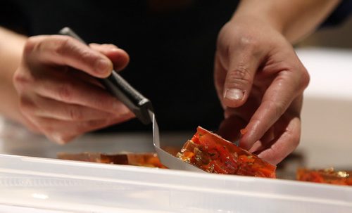 Chef Edward Lam of Yujiro prepares a terrine of foie gras and lobster. at the Gold Medal Plates food and wine event at the RBC Convention Centre Winnipeg on Oct. 16, 2015. Photo by Jason Halstead/Winnipeg Free Press RE: Social Page for Oct. 24, 2015