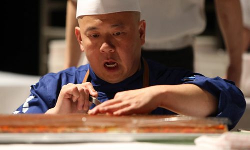 Chef Edward Lam of Yujiro prepares a terrine of foie gras and lobster.at the Gold Medal Plates food and wine event at the RBC Convention Centre Winnipeg on Oct. 16, 2015. Photo by Jason Halstead/Winnipeg Free Press RE: Social Page for Oct. 24, 2015