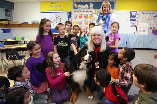 Volunteers column for the Oct. 26 issue features 71-year-old Barbara McDole.  McDole is a retired teacher, volunteers her time visiting classrooms with her specially trained dog, Cargo.  Grade one students in Lois Mackay's class at Dr. D W Penner School visit with her dog, Cole Thursday afternoon     Oct 22, 2015 Ruth Bonneville / Winnipeg Free Press