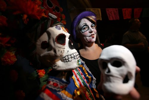 Misty Dawn from the Sparkle Girls, with her face painted at a Day of the Dead celebration at the West End Cultural Centre, Saturday, October 24, 2015. (TREVOR HAGAN/WINNIPEG FREE PRESS)