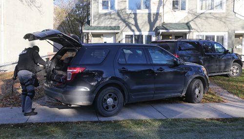 Winnipeg Police Tactical Units pack up following a standoff on Keenlyside Street, Sunday, October 25, 2015. (TREVOR HAGAN/WINNIPEG FREE PRESS)